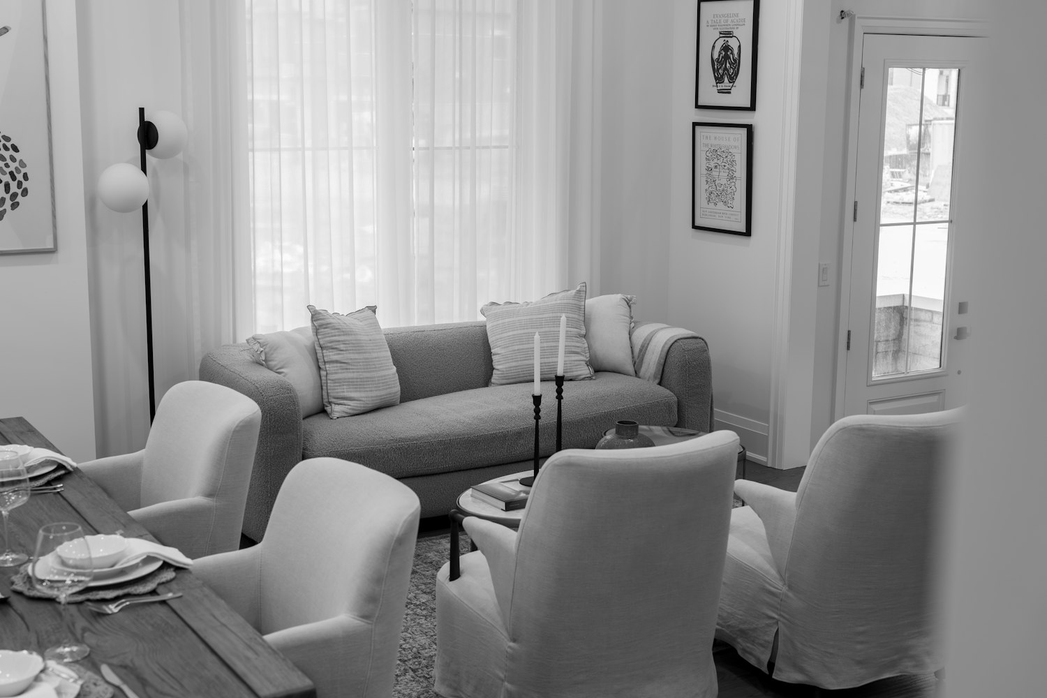 A comfortable living room with sofa and chairs, like a shared lounge in a small-house care model