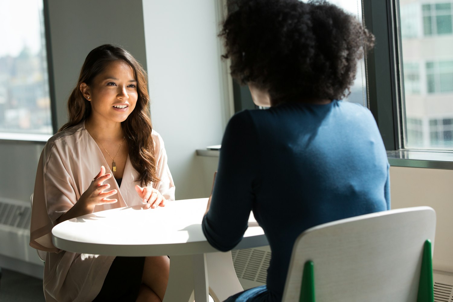 Two people seated for a job interview, the stage that follows making the certificate