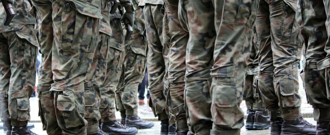 Service members standing together in uniform, the Guard and Reserve members USERRA protects