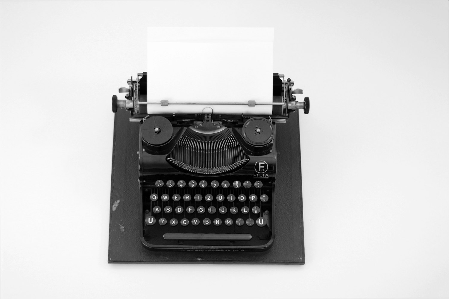 A typewriter with a blank page, representing the blank-page problem of starting a statement